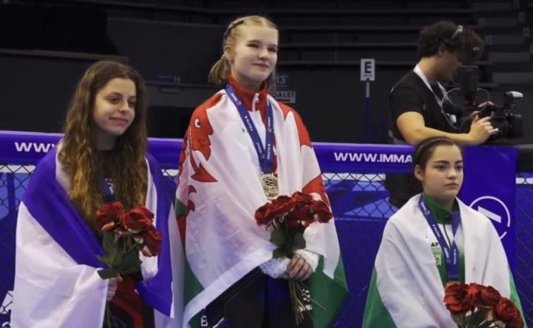 Ava Tyrie celebrates her gold medal